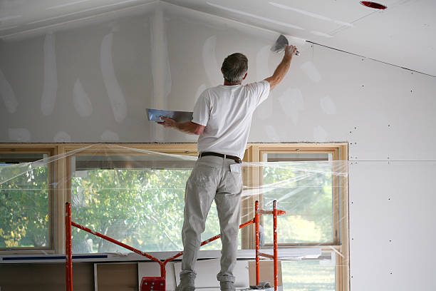 Commercial drywall repair and wall preparation before painting by an interior painter in Pasco County, FL
