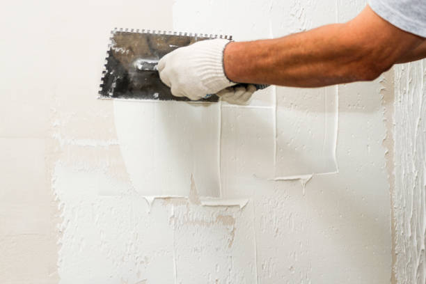 Close-up of drywall patching and surface preparation before commercial painting by an interior painter in Pasco County, FL